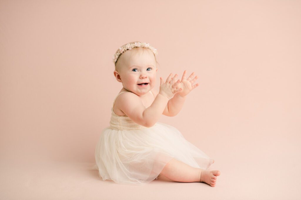 Baby Lexi getting ready for her first cake smash session in a Birmingham AL photo studio